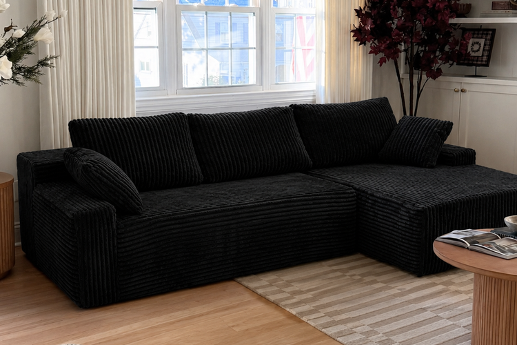 Throw pillows and blankets for a black corduroy couch